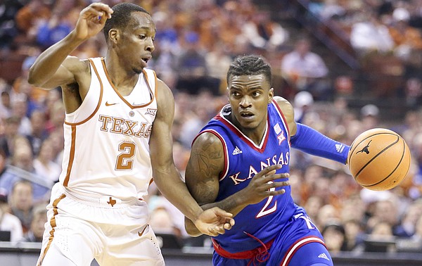 Kansas guard Lagerald Vick (2) drives against Texas guard Matt Coleman (2) during the first half on Friday, Dec. 29, 2017 at Frank Erwin Center in Austin, Texas.