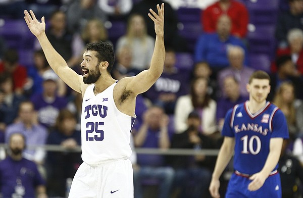 Wanting a foul called on a three point shot, TCU guard Alex Robinson (25) throws his hands in the air during the first half, Saturday, Jan. 6, 2018 at Schollmaier Arena.