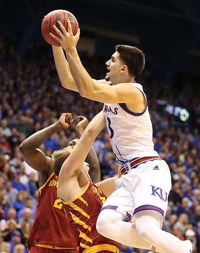 Kansas guard Sam Cunliffe (3) elevates into Iowa State forward Hans Brase (30) on a charge during the first half, Tuesday, Jan. 9, 2018 at Allen Fieldhouse.
