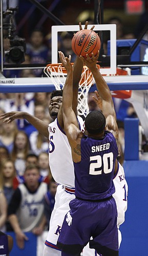 Kansas center Udoka Azubuike (35) elevates to defend against a shot form Kansas State forward Xavier Sneed (20) during the first half, Saturday, Jan. 13, 2018 at Allen Fieldhouse.