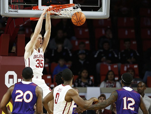 Oklahoma forward Brady Manek (35) dunks in the first half of an NCAA college basketball game against Northwestern State in Norman, Okla., Tuesday, Dec. 19, 2017. Oklahoma won 105-68.