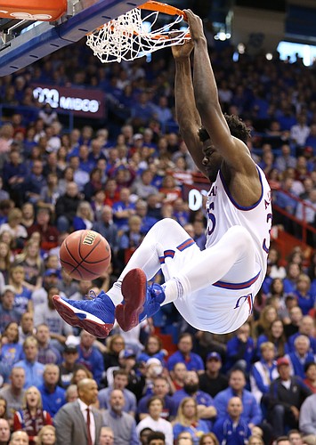 Kansas center Udoka Azubuike (35) delivers a dunk during the first half, Saturday, Jan. 27, 2018 at Allen Fieldhouse.