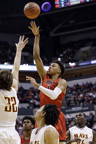 New Albany guard Romeo Langford (1) shoots over McCutcheon forward Haden Deaton (32) in the second half of the Indiana Class 4A IHSAA state championship basketball game in Indianapolis, Saturday, March 26, 2016. New Albany won 62-59. (AP Photo/AJ Mast)

