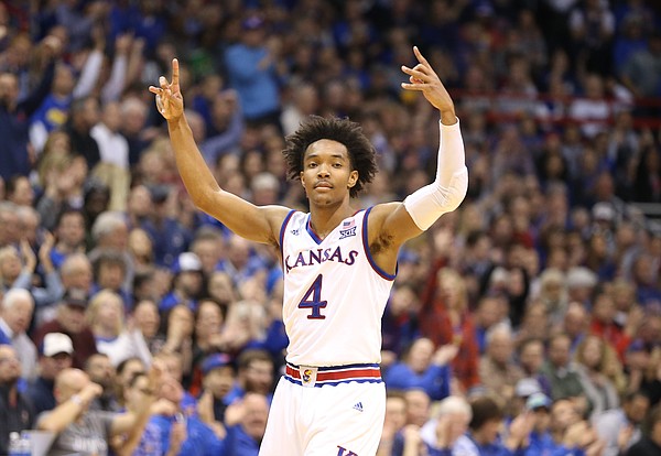 Kansas guard Devonte' Graham (4) raises up his hands after a three during the second half on Tuesday, Feb. 6, 2018 at Allen Fieldhouse.
