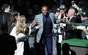 Former Boston Celtics Paul Pierce comes onto the court during a ceremony to retire his number following an NBA basketball game against the Cleveland Cavaliers in Boston, Sunday, Feb. 11, 2018. (AP Photo/Michael Dwyer)