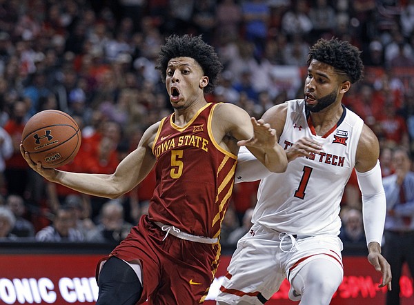 Iowa State's Lindell Wigginton (5) dribbles the ball around Texas Tech's Brandone Francis (1) during the first half of an NCAA college basketball game Wednesday, Feb. 7, 2018, in Lubbock, Texas.