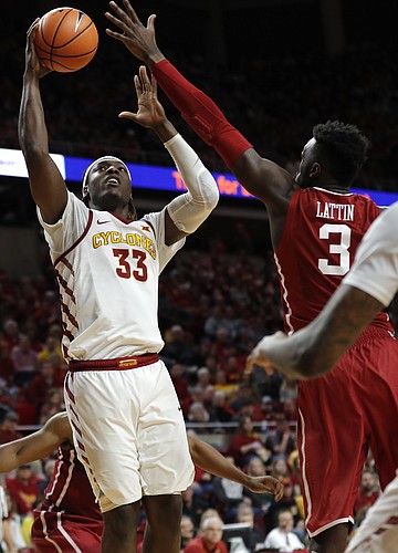 Iowa State forward Solomon Young (33) shoots over Oklahoma forward Khadeem Lattin, right, during the second half of an NCAA college basketball game, Saturday, Feb. 10, 2018, in Ames, Iowa. 