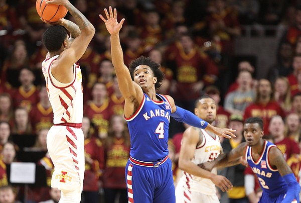 Kansas guard Devonte' Graham (4) defends against a shot from Iowa State guard Donovan Jackson (4) during the first half, Tuesday, Feb. 13, 2018 at Hilton Coliseum in Ames, Iowa.