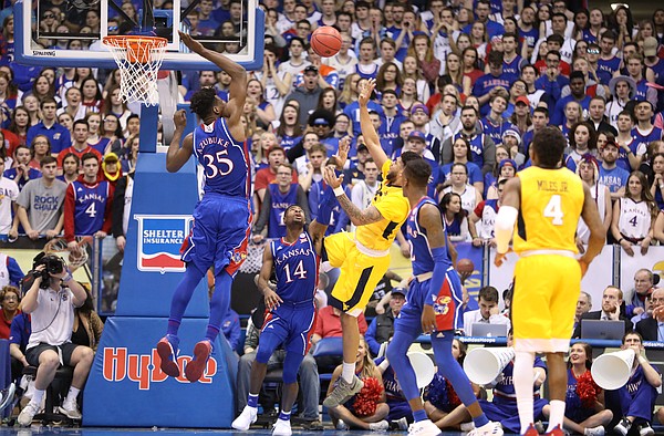 Kansas center Udoka Azubuike (35) gets up to block a shot from West Virginia forward Esa Ahmad (23) during the second half, Saturday, Feb. 17, 2018 at Allen Fieldhouse.