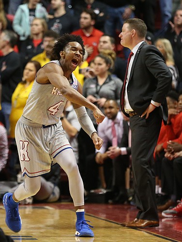 Kansas guard Devonte' Graham (4) pumps his fist after the Jayhawks locked up the win against Texas Tech on Saturday, Feb. 24, 2018 at United Supermarkets Arena.