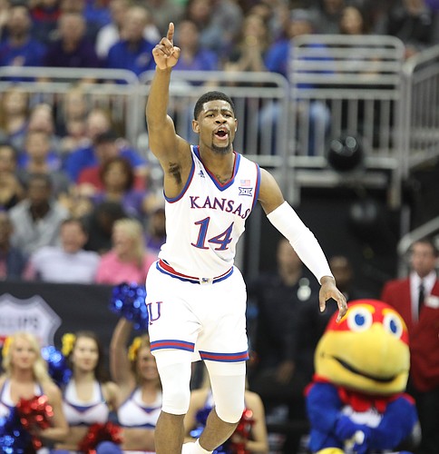 Kansas guard Malik Newman (14) signals the ball going the Jayhawks' way after a turnover by Kansas State during the first half, Friday, March 9, 2018 at Sprint Center in Kansas City, Mo.