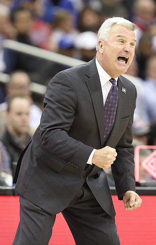 Kansas State head coach Bruce Weber gets excited during the first half, Friday, March 9, 2018 at Sprint Center in Kansas City, Mo.