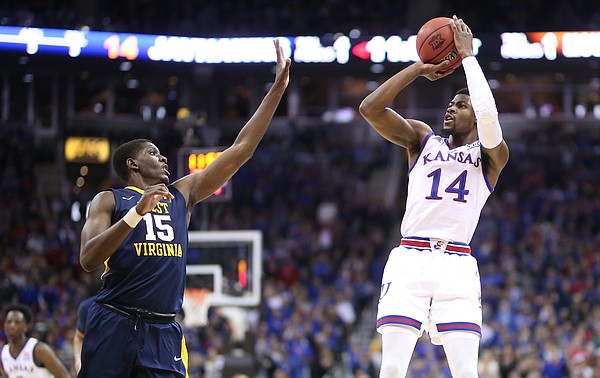 Kansas guard Malik Newman (14) pulls up for a shot against West Virginia forward Lamont West (15) during the first half, Saturday, March 10, 2018 at Sprint Center in Kansas City, Mo.