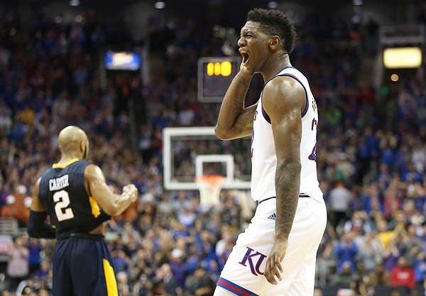 Kansas forward Silvio De Sousa (22) celebrates following the JayhawksÕ 81-70 win over the Mountaineers in the championship game of the Big 12 Tournament, Saturday, March 10, 2018 at Sprint Center in Kansas City, Mo.