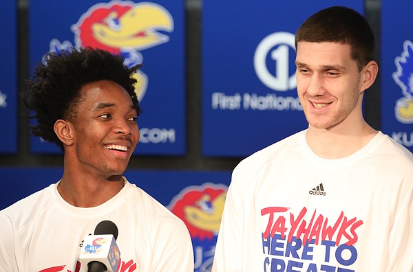 Kansas guards Devonte' Graham, left, and Sviatoslav Mykhailiuk (10) take questions about their seeding following the NCAA tournament selection show on Sunday, March 11, 2018 at Allen Fieldhouse. The Jayhawks will take on Penn in the first round, Thursday, in Wichita.