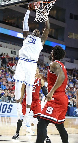 Seton Hall center Angel Delgado (31) comes in for a dunk during the second half, Thursday, March 15, 2018 at Intrust Bank Arena in Wichita, Kan.