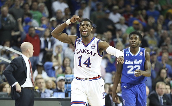 Kansas guard Malik Newman (14) pumps his fist as the Jayhawks lock up the win against Seton Hall with seconds remaining in the game, Saturday, March 17, 2018 in Wichita, Kan.