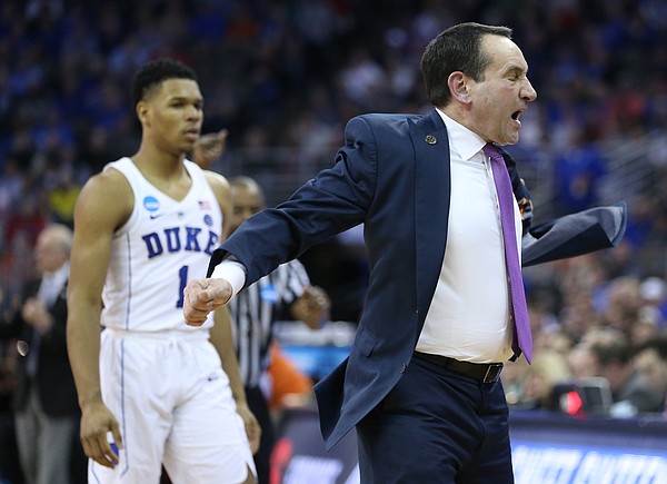 Duke head coach Mike Krzyzewski throws off his jacket in frustration during the second half, Friday, March 23, 2018 at CenturyLink Center in Omaha, Neb.
