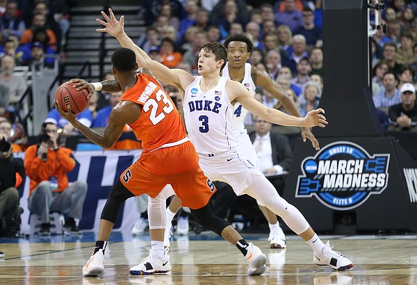 Duke guard Grayson Allen (3) defends against a pass from Syracuse guard Frank Howard (23) during the second half, Friday, March 23, 2018 at CenturyLink Center in Omaha, Neb.