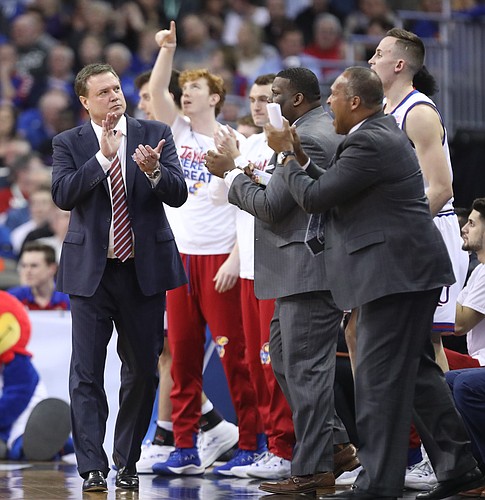 Kansas head coach Bill Self applauds the play of his team during the first half, Friday, March 23, 2018 at CenturyLink Center in Omaha, Neb.