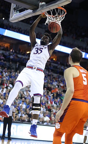 Kansas center Udoka Azubuike (35) delivers a jam before Clemson forward Mark Donnal (5) during the first half, Friday, March 23, 2018 at CenturyLink Center in Omaha, Neb.
