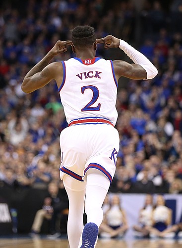 Kansas guard Lagerald Vick (2) celebrates a three during the second half, Sunday, March 25, 2018 at CenturyLink Center in Omaha, Neb.