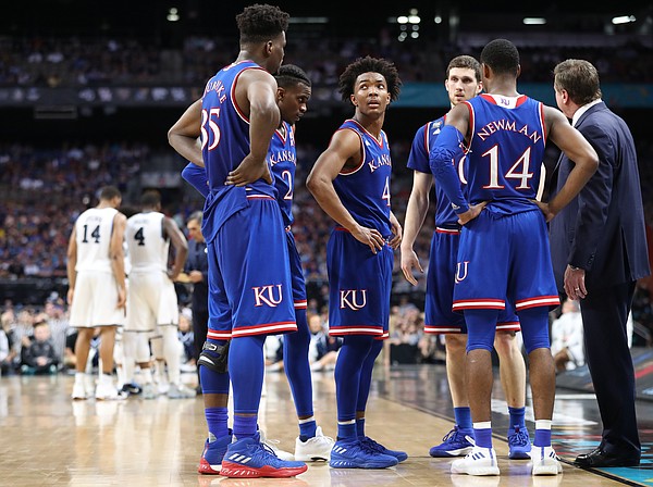 Kansas guard Devonte' Graham (4) glances at the scoreboard during a timeout in the second half, Saturday, March 31, 2018 at the Alamodome in San Antonio, Texas.