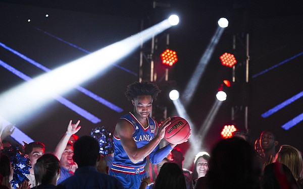 Kansas guard Devonte' Graham pump fakes with a ball as he dances on a stage before fans during a video recording with Turner CBS on Thursday, March 29, 2018 at the Alamodome in San Antonio.