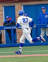 Kansas' Devin Foyle runs to first base after a base hit, Saturday, April 14, 2018, during a game against TCU at Hoglund Ballpark. The Jayhawks fell to TCU, 13-3.