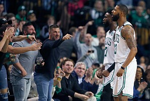 Fans react after Boston Celtics' Marcus Morris (13) was fouled while shooting during the first quarter of Game 1 of an NBA basketball first-round playoff series against the Milwaukee Bucks, in Boston, Sunday, April 15, 2018. (AP Photo/Michael Dwyer)