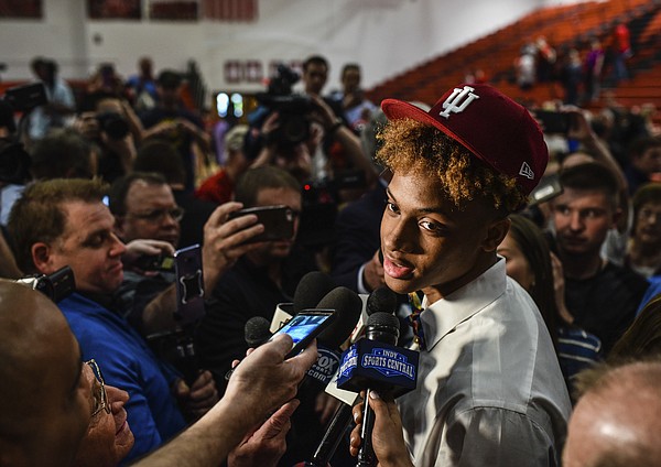 Romeo Langford discusses his decision to continue his basketball career at Indiana University following his college announcement ceremony at New Albany High School, Monday, April 30, 2018, in New Albany, Ind. 
