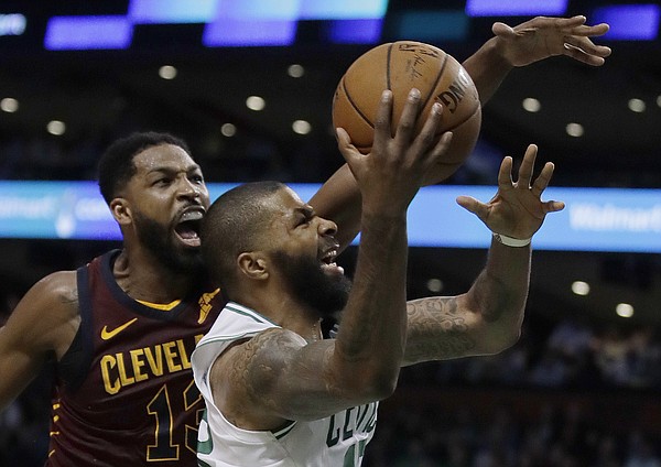 Boston Celtics forward Marcus Morris drives to the basket against Cleveland Cavaliers center Tristan Thompson, left, during the second half in Game 2 of the NBA basketball Eastern Conference finals Tuesday, May 15, 2018, in Boston. (AP Photo/Charles Krupa)