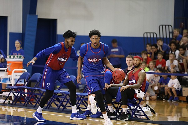 KU forward Dedric Lawson (1) makes a move to get by his brother, K.J. Lawson during the Jayhawks camp scrimmage on Tuesday, June 5, 2018, at Horejsi Center. 
