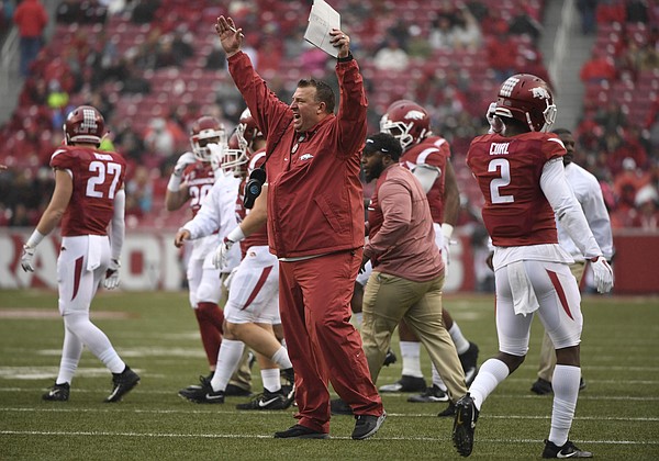 In this Nov. 18, 2017, file photo, Arkansas coach Bret Bielema talks with the officials during the first half of an NCAA college football game against Mississippi State in Fayetteville, Ark. The Razorbacks are dealing with their own dose of turmoil at the moment. Last week’s 28-21 loss to No. 16 Mississippi State guaranteed Arkansas’ third losing season in the last six years, and it came days after the school fired former athletic director Jeff Long. There’s likely more uncertainty ahead in the days following Friday’s game against Missouri for Arkansas--in particular for fifth-year coach Bielema. (AP Photo/Michael Woods, File)