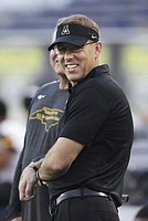 Appalachian State head coach Scott Satterfield stands on the sideline as his team warms up to play against Toledo in the Dollar General Bowl NCAA college football game, Saturday, Dec. 23, 2017, in Mobile, Ala. (AP Photo/Dan Anderson)