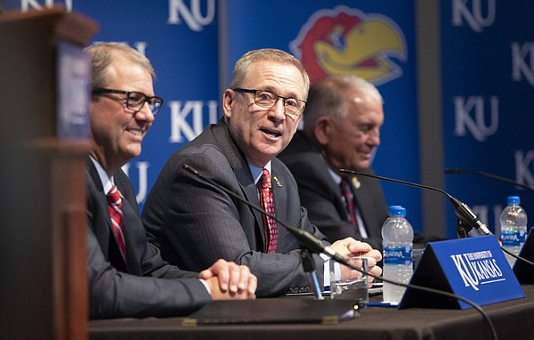 New University of Kansas athletic director Jeff Long addresses those gathered for his introductory news conference on Wednesday, July 11, 2018 at the Lied Center Pavilion. To his left is University of Kansas Chancellor Douglas Girod and at his right is former