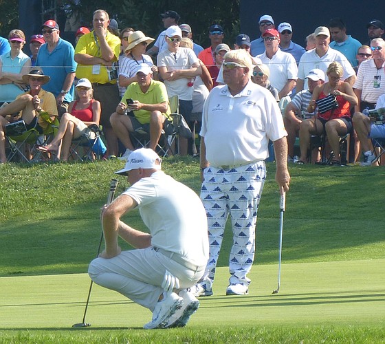 Former KU All-American Ryan Vermeer sizes up the birdie putt he made on No. 8 at Bellerive on Friday in the 100th PGA as John Daly waits his turn. (Photo by Tom Keegan)