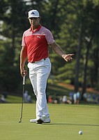 Gary Woodland reacts to a missed putt on the 12th green during the second round of the PGA Championship golf tournament at Bellerive Country Club, Friday, Aug. 10, 2018, in St. Louis. (AP Photo/Jeff Roberson)