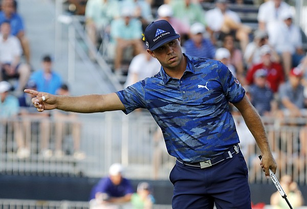 Gary Woodland gestures after putting on the 18th green during the third round of the PGA Championship golf tournament at Bellerive Country Club, Saturday, Aug. 11, 2018, in St. Louis. (AP Photo/Brynn Anderson)