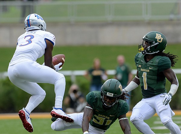 Kansas wide receiver Evan Fairs (3) drops a pass covered by Baylor cornerback Harrison Hand (31) and Baylor safety Verkedric Vaughns (1) during the first half of an NCAA college football game, Saturday, Sept. 22, 2018, in Waco, Texas. 