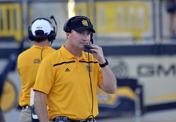 Kennesaw State head coach Brian Bohannon talks into his head set during an NCAA college football game against Edward Waters, Saturday, Sept. 12, 2015, in Kennesaw, Ga. (AP Photo/Lisa Marie Pane)
