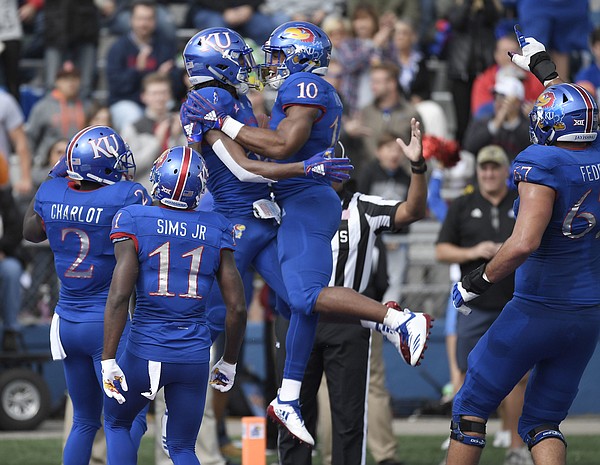 Kansas wide receiver Kwamie Lassiter celebrates with running back Khalil Herbert following a touchdown against Oklahoma State on Saturday, Sept. 29, 2018.