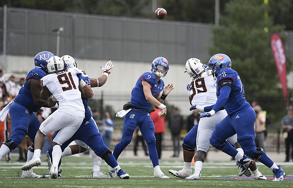 Kansas junior quarterback Carter Stanley throws the ball downfield to a teammate on Saturday, Sept. 29, 2018.