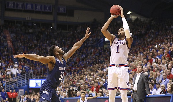 Kansas forward Dedric Lawson (1) pulls up for a three over Washburn guard Emeka Ogbonna (32) during the second half of an exhibition, Thursday, Nov. 1, 2018 at Allen Fieldhouse.