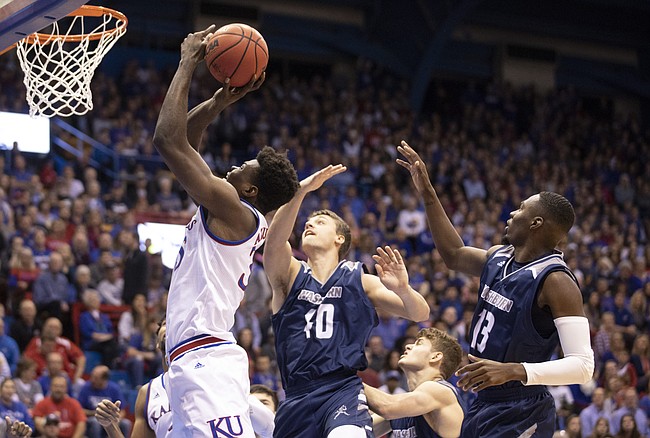 Kansas center Udoka Azubuike (35) gets to the bucket past Washburn forward David Salach (40) and Washburn guard Tyas Martin (13) during the first half of an exhibition, Thursday, Nov. 1, 2018, at Allen Fieldhouse.