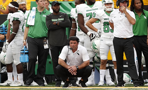 North Texas head coach Seth Littrell, center, watches from the sideline during the second half of an NCAA college football game against Iowa, Saturday, Sept. 16, 2017, in Iowa City, Iowa. (AP Photo/Charlie Neibergall)