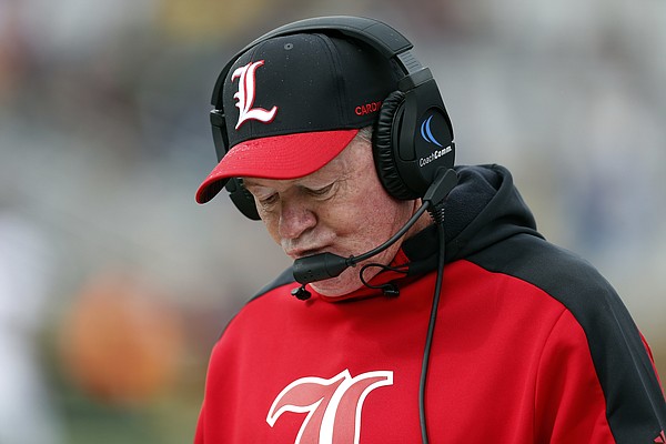 FILE — Louisville head coach Bobby Petrino during the first half of an NCAA college football game against Boston College in Boston, Saturday, Oct. 13, 2018. Louisville fired Petrino on Sunday, Nov. 11, 2018. (AP Photo/Michael Dwyer)