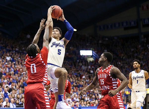 Kansas guard Quentin Grimes (5) pulls up for a shot against Louisiana guard Cedric Russell (0) during the second half, Friday, Nov. 16, 2018 at Allen Fieldhouse.