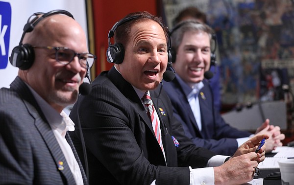 Newly-hired Kansas head football coach Les Miles shares the story of how he met his wife between radio broadcasters David Lawrence, left, and Brian Hanni, back right, during the "Hawk Talk" radio show on Sunday, Nov. 18, 2018, at Johnny's West in Lawrence.