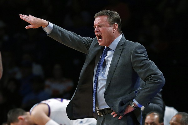Kansas coach Bill Self gestures to his team during the second half of an NCAA college basketball game against Tennessee in the NIT Season Tip-Off tournament Friday, Nov. 23, 2018, in New York. Kansas defeated Tennessee 87-81 in overtime. (AP Photo/Adam Hunger)